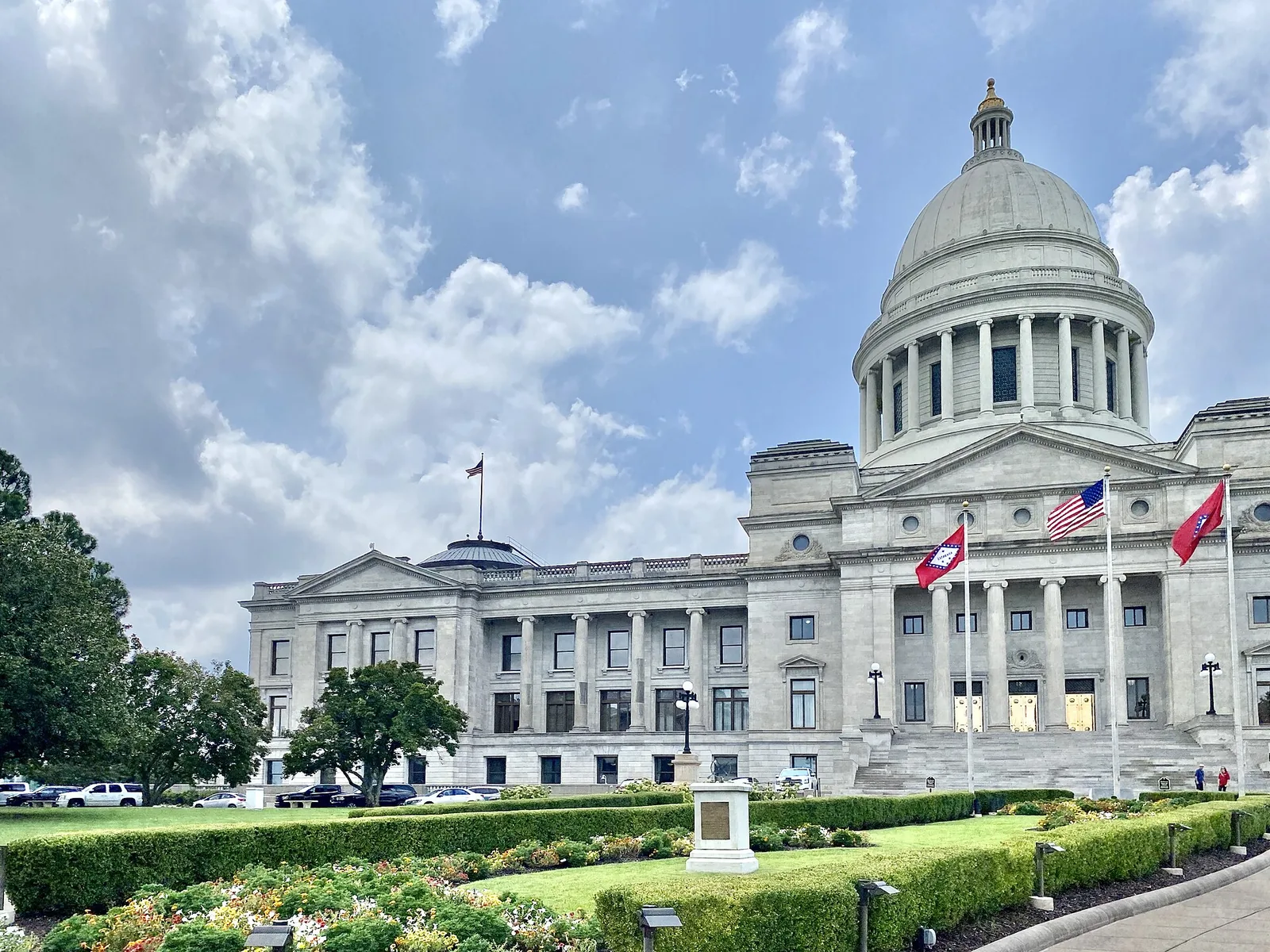 The domed Arkansas State Capitol building in Little Rock, seen across its front lawn